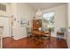 Bright dining area with wood floors, chandelier, and a view of the backyard at 1285 Salt Lake Dr, Tarpon Springs, FL 34689