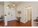 Inviting entryway with wood floors, decorative accents, and bright natural light at 1285 Salt Lake Dr, Tarpon Springs, FL 34689