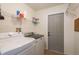 Bright laundry room featuring new washer and dryer at 1285 Salt Lake Dr, Tarpon Springs, FL 34689