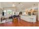 Open concept living room featuring wood floors, large windows, and modern decor at 1285 Salt Lake Dr, Tarpon Springs, FL 34689