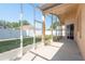 Enclosed patio with screened enclosure overlooks the backyard at 1285 Salt Lake Dr, Tarpon Springs, FL 34689