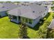 Expansive backyard with a well-maintained lawn and a covered patio, perfect for outdoor entertaining at 15329 Renaissance Ave, Odessa, FL 33556