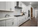 Modern kitchen showcasing white cabinets, stainless steel appliances, and a sleek countertop at 15329 Renaissance Ave, Odessa, FL 33556