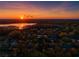 Breathtaking aerial view of the neighborhood and lake at sunset at 16819 Stanza Ct, Tampa, FL 33624