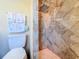 Beautiful bathroom featuring a rainfall shower head and designer tile at 16819 Stanza Ct, Tampa, FL 33624