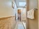 Bathroom with a view to shower featuring neutral tile, and built in bench at 16819 Stanza Ct, Tampa, FL 33624