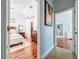 Open view of a bedroom, bathroom, and closet showcasing the layout and hardwood floors at 16819 Stanza Ct, Tampa, FL 33624