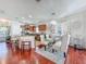 Bright dining room and kitchen area featuring hardwood floors and stylish decor at 16819 Stanza Ct, Tampa, FL 33624