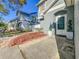 Charming front entrance with decorative landscaping, enhancing curb appeal and welcoming guests at 16819 Stanza Ct, Tampa, FL 33624