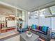 A well appointed screened porch featuring an exercise machine and comfortable seating at 16819 Stanza Ct, Tampa, FL 33624