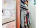 Bedroom with closet view featuring an organized storage solution for clothes at 16819 Stanza Ct, Tampa, FL 33624