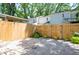 Secluded brick patio enclosed by a wooden fence with ample space for outdoor activities at 1728 Mill Run Cir, Tampa, FL 33613