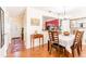 Inviting dining room with an entry view, hardwood floors, and modern lighting at 1728 Mill Run Cir, Tampa, FL 33613