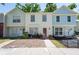 Charming townhome with a well-maintained exterior, neat landscaping, and inviting front porch at 1728 Mill Run Cir, Tampa, FL 33613