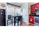 Bright eat-in kitchen featuring an elegant table set and a view of the sleek, red kitchen cabinets at 1728 Mill Run Cir, Tampa, FL 33613