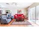 Bright living room featuring a comfortable seating arrangement and sliding doors to the outdoor patio at 1728 Mill Run Cir, Tampa, FL 33613