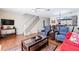 Inviting living room featuring modern furniture, a staircase, and an open layout at 1728 Mill Run Cir, Tampa, FL 33613