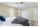 Comfortable main bedroom with two windows offering plenty of natural light and a large closet at 1728 Mill Run Cir, Tampa, FL 33613