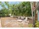 Backyard features tropical landscaping and a patio set at 1736 23Rd N Ave, St Petersburg, FL 33710