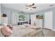 Comfortable bedroom with a ceiling fan, bright window and connected bathroom at 1736 23Rd N Ave, St Petersburg, FL 33710