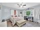 Charming bedroom with a ceiling fan, bright window, and stylish decor at 1736 23Rd N Ave, St Petersburg, FL 33710