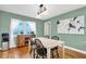 Bright dining room featuring wood floors, stylish lighting, and a window with natural light at 1736 23Rd N Ave, St Petersburg, FL 33710