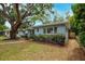 Charming home features mature landscaping and a long driveway at 1736 23Rd N Ave, St Petersburg, FL 33710