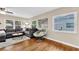 Inviting living room with a comfortable sectional sofa and hardwood flooring at 1736 23Rd N Ave, St Petersburg, FL 33710