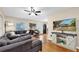 Comfortable living room featuring hardwood floors and a large sectional couch at 1736 23Rd N Ave, St Petersburg, FL 33710