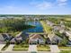 Stunning aerial view of a lakeside community featuring beautiful homes and lush landscaping at 17917 Machair Ln, Land O Lakes, FL 34638