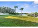 Lush backyard with beautiful lake views and mature trees at 17917 Machair Ln, Land O Lakes, FL 34638