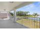 Large balcony with stunning lake views, perfect for enjoying the outdoors at 17917 Machair Ln, Land O Lakes, FL 34638