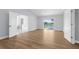 Bright, airy bedroom with wood-look floors, large windows, and views of the water at 17917 Machair Ln, Land O Lakes, FL 34638