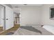 Serene bedroom featuring a bed, soft rug, and wood-look floors at 17917 Machair Ln, Land O Lakes, FL 34638