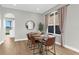 Dining area features a wooden table, seating, and a window view, creating an inviting space at 17917 Machair Ln, Land O Lakes, FL 34638