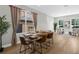 Dining space with a wooden table, modern chairs, and bright windows, perfect for Gathering gatherings at 17917 Machair Ln, Land O Lakes, FL 34638