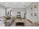 Cozy living room featuring a plush rug, comfortable seating, and stylish decor at 17917 Machair Ln, Land O Lakes, FL 34638