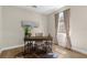 Bright office with hardwood floors, modern desk with shelves, neutral walls and lots of light at 17917 Machair Ln, Land O Lakes, FL 34638