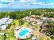 Aerial view of a home and the community pool, showcasing its location and surrounding greenery at 1821 Bough Ave # 4, Clearwater, FL 33760
