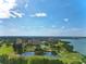 Scenic aerial view of a community near the water, with golf courses, lakes, and stunning landscape at 1821 Bough Ave # 4, Clearwater, FL 33760