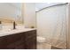 Bright bathroom featuring a modern vanity, updated fixtures, and a shower with a patterned curtain at 1821 Bough Ave # 4, Clearwater, FL 33760