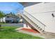The exterior of the building includes stairs and lush green grass adding curb appeal to the property at 1821 Bough Ave # 4, Clearwater, FL 33760