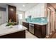 Modern kitchen with white and brown cabinets, sleek stainless steel appliances, and a stylish backsplash at 1821 Bough Ave # 4, Clearwater, FL 33760