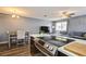 Open-concept kitchen flowing into the living space with stainless appliances, an island, and ample seating at 1821 Bough Ave # 4, Clearwater, FL 33760