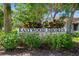 Eastwood Shores neighborhood sign with lush landscaping, creating a welcoming entrance to the community at 1821 Bough Ave # 4, Clearwater, FL 33760