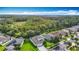 Beautiful aerial view of a home with lush green lawn and mature trees backing up to green space at 2256 Pantucket Dr, Wesley Chapel, FL 33543