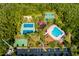 Aerial view of community amenities including a pool, tennis courts, basketball courts, and parking at 2256 Pantucket Dr, Wesley Chapel, FL 33543