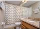 Bathroom featuring granite vanity and shower with patterned shower curtain at 2256 Pantucket Dr, Wesley Chapel, FL 33543