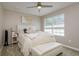 Bedroom with white tufted headboard and fuzzy blanket, plus ceiling fan at 2256 Pantucket Dr, Wesley Chapel, FL 33543
