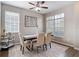 Bright dining room with three large windows, a modern light fixture, and neutral decor at 2256 Pantucket Dr, Wesley Chapel, FL 33543